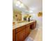 Double vanity bathroom with granite countertops at 3801 S Atlantic Ave # 303, Daytona Beach Shores, FL 32118