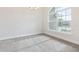 Dining room with large window and carpeted floor at 243 Lagoon Mist Court, Oak Hill, FL 32759