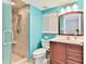 Bathroom with walk-in shower and wood vanity at 1183 Ocean Shore Blvd # 5050, Ormond Beach, FL 32176