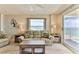Living room with ocean view and seating near balcony at 1183 Ocean Shore Blvd # 5050, Ormond Beach, FL 32176