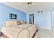 Spacious bedroom with king-size bed and ceiling fan at 1183 Ocean Shore Blvd # 5050, Ormond Beach, FL 32176