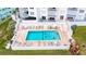 Inviting community pool with lounge chairs and plenty of space for relaxation at 1183 Ocean Shore Blvd # 5050, Ormond Beach, FL 32176