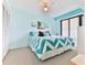 Bedroom with king-size bed and chevron bedding at 1183 Ocean Shore Blvd # 5050, Ormond Beach, FL 32176