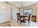 Dining area with round table and chairs, near entryway and closet at 1183 Ocean Shore Blvd # 5050, Ormond Beach, FL 32176