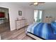 Main bedroom with dresser and balcony access at 231 Riverside Dr # 1106-1, Holly Hill, FL 32117