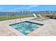 Soothing hot tub with waterfront views and lounge chairs at 231 Riverside Dr # 1106-1, Holly Hill, FL 32117