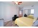 Bright bedroom with a queen bed, built-in shelving, and sliding mirrored closet doors at 231 Riverside Dr # 1106-1, Holly Hill, FL 32117