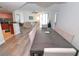 Dining room with large table and view into living room at 231 Riverside Dr # 1106-1, Holly Hill, FL 32117
