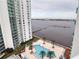 Aerial view of community pool and waterfront property at 231 Riverside Dr # 1106-1, Holly Hill, FL 32117