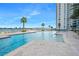 Large, refreshing pool with lounge chairs and water views at 231 Riverside Dr # 1106-1, Holly Hill, FL 32117