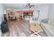 Open concept living and dining area with hardwood floors at 231 Riverside Dr # 1106-1, Holly Hill, FL 32117