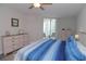 Main bedroom with large bed and dresser at 231 Riverside Dr # 1106-1, Holly Hill, FL 32117