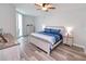 Main bedroom with king-size bed and access to balcony at 231 Riverside Dr # 1106-1, Holly Hill, FL 32117