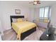 Spacious bedroom with queen bed and daybed, featuring light flooring and decor at 231 Riverside Dr # 1106-1, Holly Hill, FL 32117