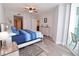 Main bedroom with large bed and access to balcony at 231 Riverside Dr # 1106-1, Holly Hill, FL 32117