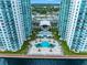 Aerial view showcasing the pool and waterfront location at 231 Riverside Dr # 1106-1, Holly Hill, FL 32117