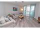 Spacious living room with water views and comfy sofas at 231 Riverside Dr # 1106-1, Holly Hill, FL 32117