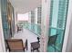 Spacious balcony with outdoor seating, featuring stunning city views at 231 Riverside Dr # 1106-1, Holly Hill, FL 32117