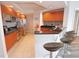 Modern kitchen with wood cabinets, granite counters, and stainless steel appliances at 231 Riverside Dr # 1106-1, Holly Hill, FL 32117