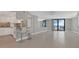 Open kitchen with white cabinets and breakfast bar at 1415 Ocean Shore Blvd # 1112, Ormond Beach, FL 32176
