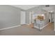 Modern kitchen with white cabinets and breakfast bar at 1415 Ocean Shore Blvd # 1112, Ormond Beach, FL 32176
