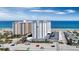 Oceanfront view of two buildings and parking lot at 1415 Ocean Shore Blvd # 1112, Ormond Beach, FL 32176