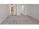 Simple bedroom with carpet flooring and access to bathroom at 1415 Ocean Shore Blvd # 1112, Ormond Beach, FL 32176