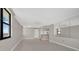 Open living room with kitchen access and tile flooring at 1415 Ocean Shore Blvd # 1112, Ormond Beach, FL 32176