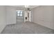Bright bedroom featuring mirrored closet doors and carpet flooring at 1415 Ocean Shore Blvd # 1112, Ormond Beach, FL 32176