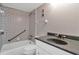 Clean bathroom with granite countertop and patterned wall tile at 1415 Ocean Shore Blvd # 1112, Ormond Beach, FL 32176