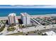 Oceanfront view of two buildings and parking lot at 1415 Ocean Shore Blvd # 1112, Ormond Beach, FL 32176