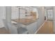Modern kitchen with breakfast bar and white appliances at 1415 Ocean Shore Blvd # 1112, Ormond Beach, FL 32176