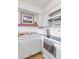 Bright white kitchen features modern appliances and ample cabinetry at 1433 N Atlantic Ave # 422, Daytona Beach, FL 32118