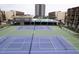Community tennis courts with green surface and blue court markings at 1433 N Atlantic Ave # 422, Daytona Beach, FL 32118