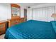 Bedroom with king-size bed, built-in dresser, and closet at 1433 N Atlantic Ave # 422, Daytona Beach, FL 32118