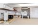 Clean and functional kitchen with white cabinetry and microwave at 1433 N Atlantic Ave # 422, Daytona Beach, FL 32118