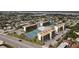 Aerial view showcasing condo complex near beach, with ample parking and tennis courts at 1433 N Atlantic Ave # 422, Daytona Beach, FL 32118