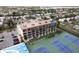 Aerial view of condo building highlighting its location near tennis courts at 1433 N Atlantic Ave # 422, Daytona Beach, FL 32118
