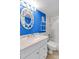 Bathroom with white vanity, blue walls, and a shower/tub combo at 1433 N Atlantic Ave # 422, Daytona Beach, FL 32118