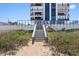 Beach access staircase from building to sand at 1239 Ocean Shore Blvd # 7E5, Ormond Beach, FL 32176