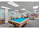Community game room with pool table, ping pong, and books at 1239 Ocean Shore Blvd # 7E5, Ormond Beach, FL 32176