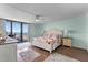 Main bedroom with ocean view, king-size bed, and ceiling fan at 1239 Ocean Shore Blvd # 7E5, Ormond Beach, FL 32176