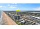 Aerial view showing building's proximity to beach and highway at 1239 Ocean Shore Blvd # 7E5, Ormond Beach, FL 32176