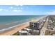 Aerial view of oceanfront building, highlighting its location at 1239 Ocean Shore Blvd # 7E5, Ormond Beach, FL 32176