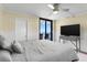 Bedroom with ocean view, king-size bed, and a modern TV stand at 1239 Ocean Shore Blvd # 7E5, Ormond Beach, FL 32176