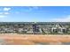 Aerial view of beachfront high-rise condo building with pool and ocean views at 1239 Ocean Shore Blvd # 7E5, Ormond Beach, FL 32176