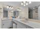 Condo bathroom with double sinks, large mirror, and ample counter space at 1239 Ocean Shore Blvd # 7E5, Ormond Beach, FL 32176