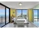 Condo dining area with ocean view and white table at 1239 Ocean Shore Blvd # 7E5, Ormond Beach, FL 32176