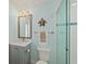 Updated bathroom with a walk-in shower, modern vanity, and stylish decor at 4711 S Atlantic Ave, Ponce Inlet, FL 32127