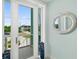 Bright entryway with a view of the street and decorative mirror at 4711 S Atlantic Ave, Ponce Inlet, FL 32127